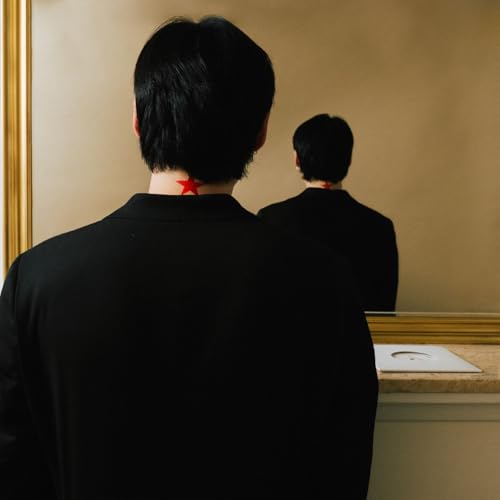 Person with a red star on their neck, facing a mirror.