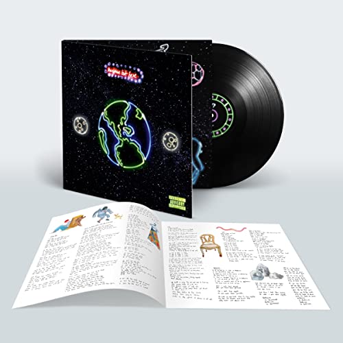 Vinyl record with space-themed cover art, lyric sheet, and tracklist visible.