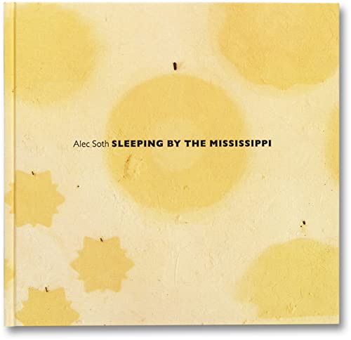 Book with serene river scene, likely a calm Mississippi landscape at dusk or night.