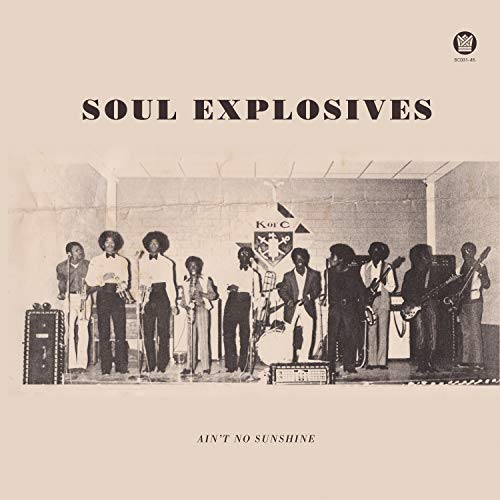 Vintage album cover featuring a nine-piece band performing on stage.