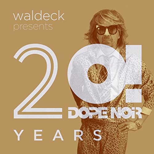 Man in sunglasses and leopard print suit, with large numbers "20!".