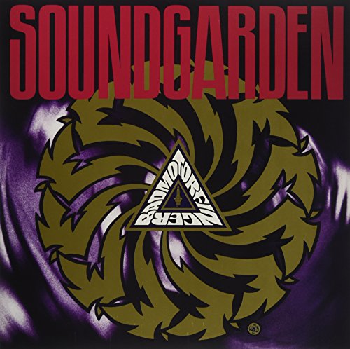 Soundgarden Badmotorfinger album cover with a gold spiky circular design on purple background.