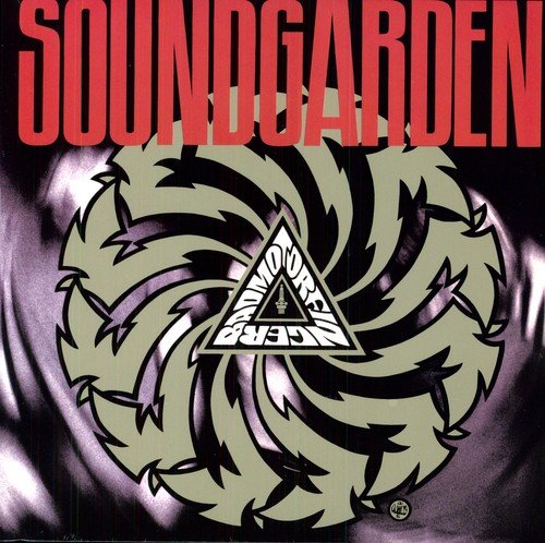 Soundgarden album cover with red title and swirling gold emblem on black background.