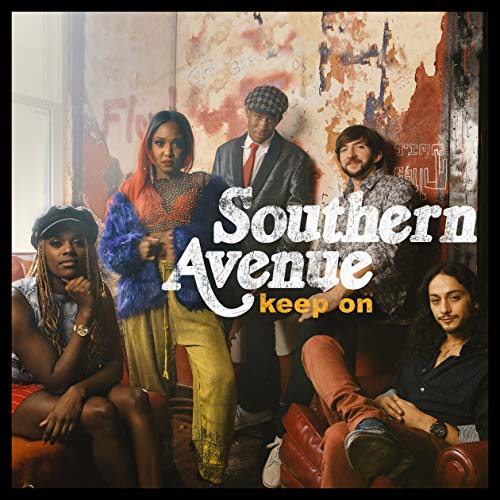 "Album cover featuring five people posing in front of a distressed wall."