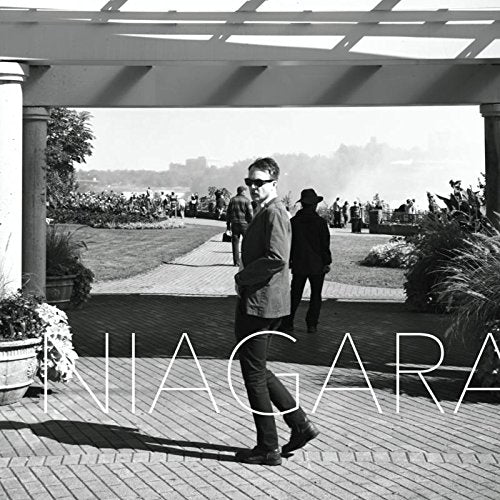 Black and white album cover with man walking on a brick path, "NIAGARA" text overlay.