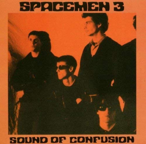 "Vinyl album cover with a sepia-toned photo of four men in dark clothing."