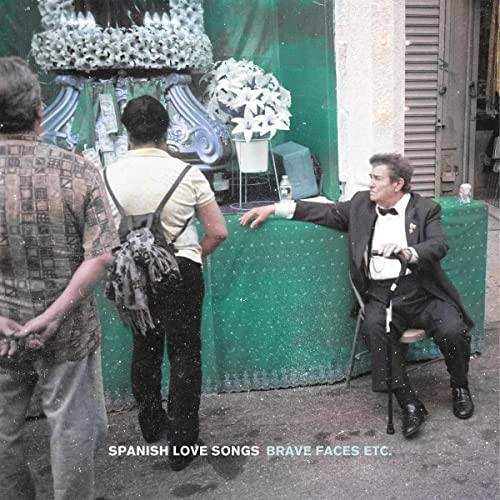 Album cover: men near a floral shrine, text “Spanish Love Songs”.