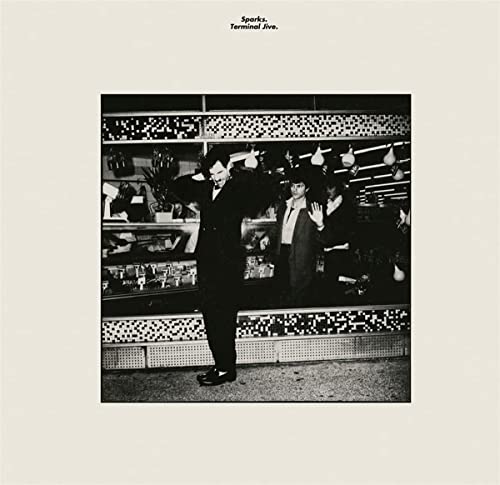 Black and white albumSCSLL album cover featuring three men in suits.