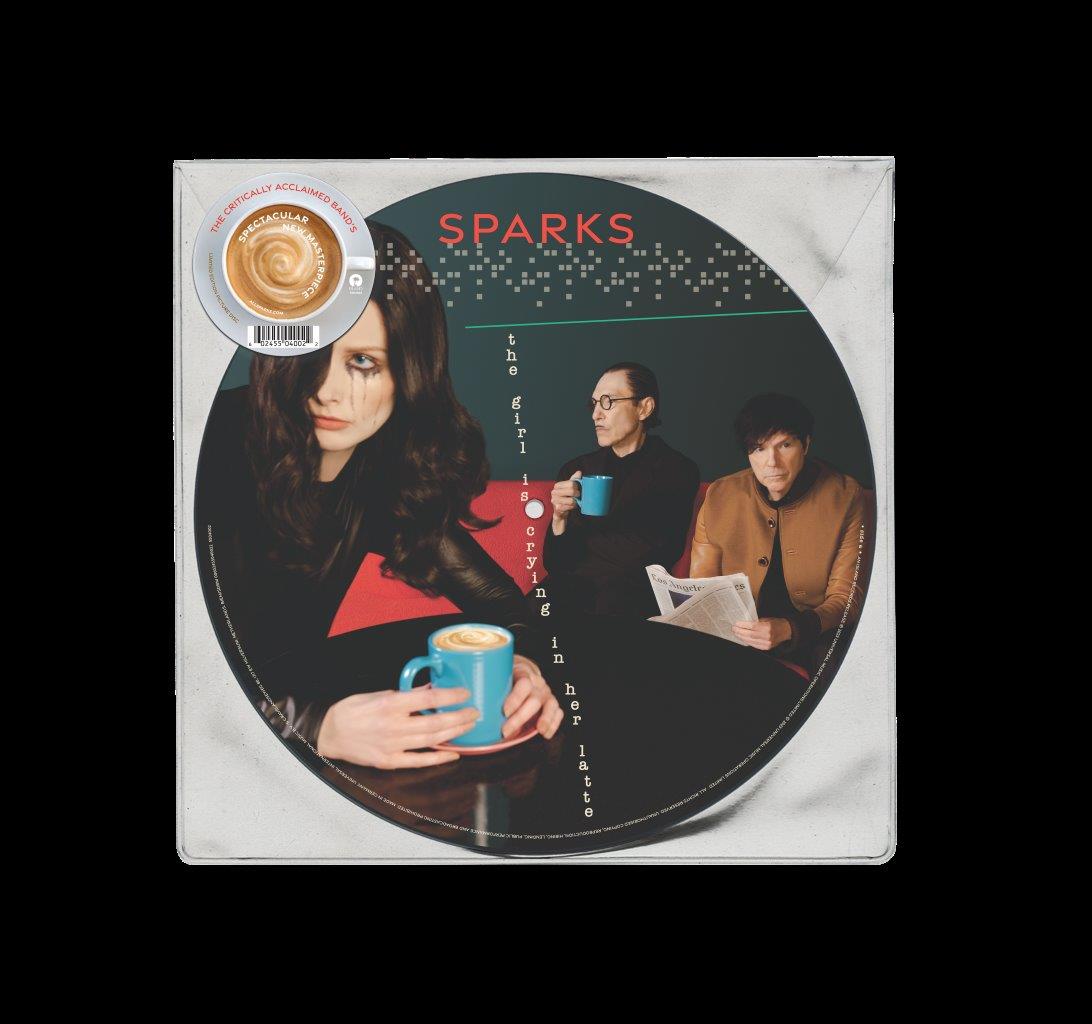A vinyl record sleeve featuring a woman crying and two men in a café.