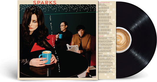 Woman crying with latte on album cover next to vinyl record and sleeve.