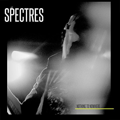 Black and white album cover with a person singing into a microphone, surrounded by fog.
