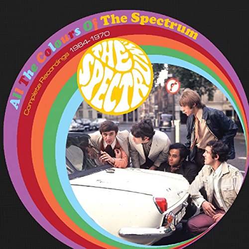 CD cover featuring The Spectrum band members around a white car with rainbow border.