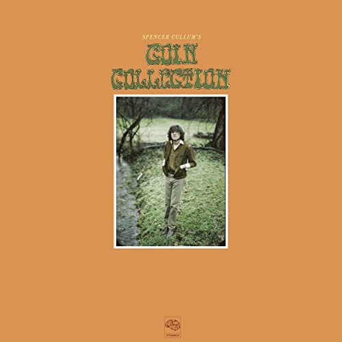 Vinyl cover with orange background, green text, and a photo of a man outdoors.
