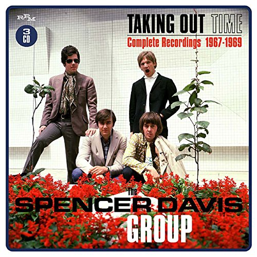 Four men pose behind red flowers on the Spencer Davis Group CD cover.