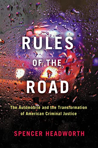 Book cover: “Rules of the Road” with blurred car headlights and rain.