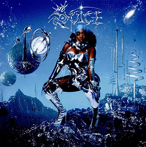 A person in metallic clothing poses on a rocky, blue alien landscape under stars.