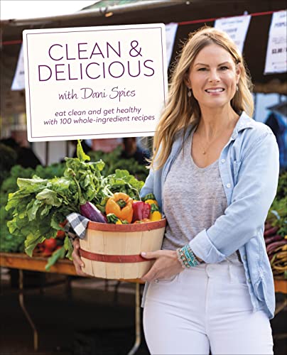 Cookbook cover with woman holding basket of colorful produce.