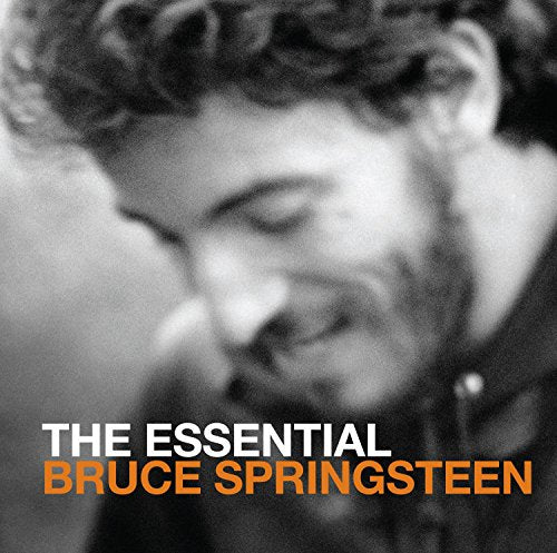 Close-up black and white portrait of Bruce Springsteen with album title.