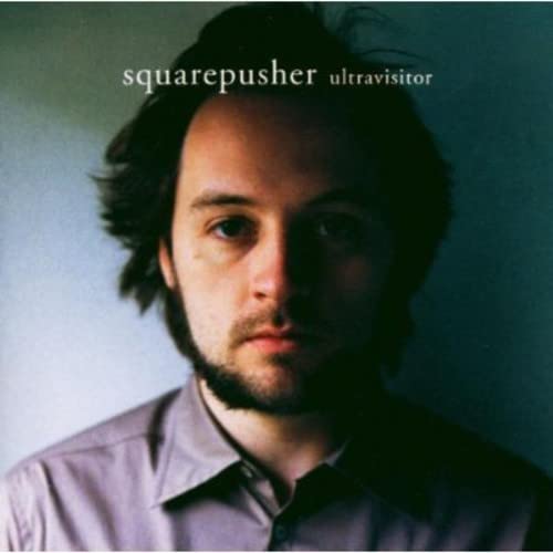 Squarepusher album cover featuring a portrait of a man with dark hair.