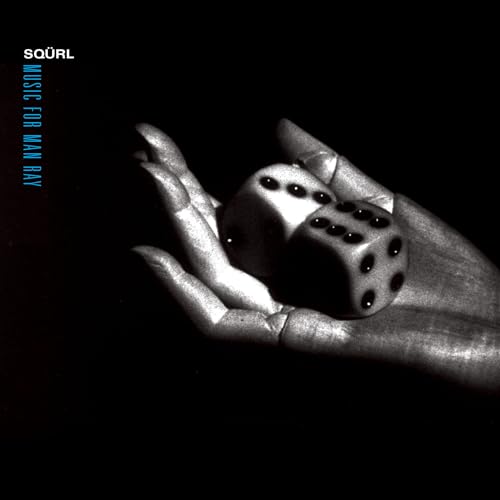 Black and white album cover with a hand holding a die.
