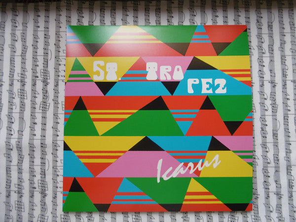 Colorful album cover for St. Tropez's "Icarus" with geometric shapes.