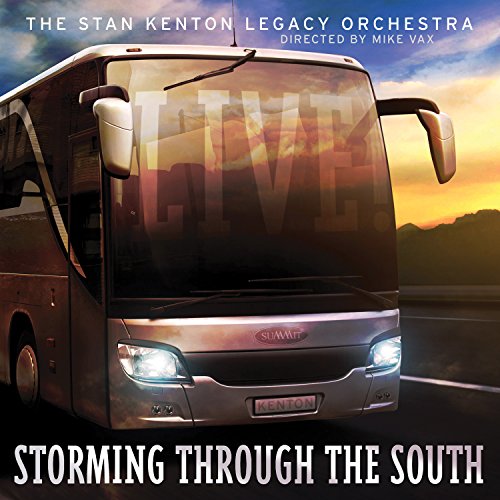 "Album cover featuring a tour bus driving down a road at sunset."