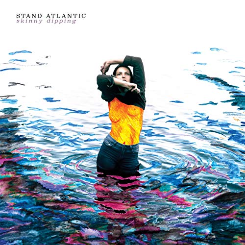 Album cover: woman partially submerged in colorful, rippling water.