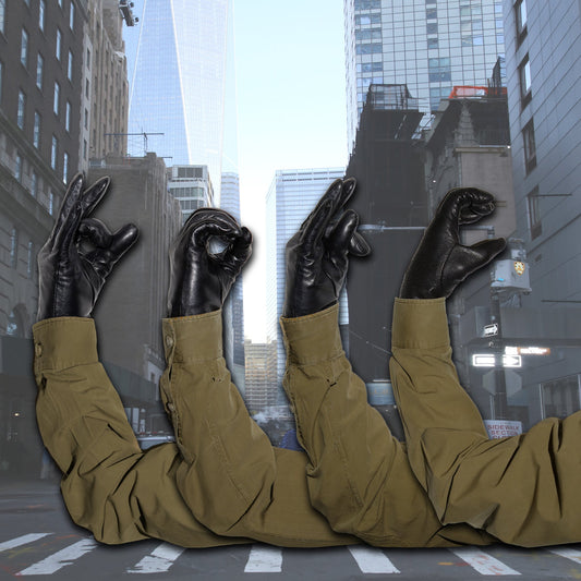 Four arms with black gloves making hand gestures in a city street.