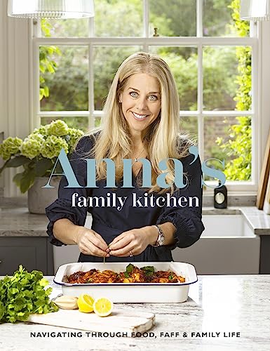 Book cover featuring blonde woman in kitchen with prepared food.