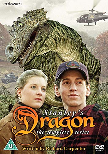"DVD cover featuring a man, woman, and large green dragon with a helicopter in background."