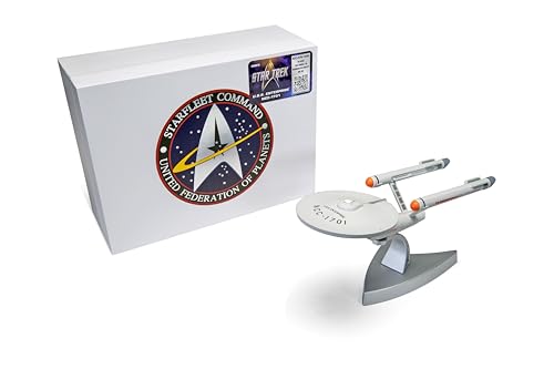 Silver model of the USS Enterprise with its box featuring a Starfleet Command logo.