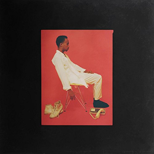 CD cover: man in white seated, with shoes and a Walkman.