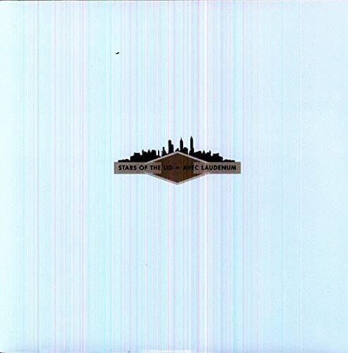 Vinyl record cover: light blue with a dark cityscape emblem.