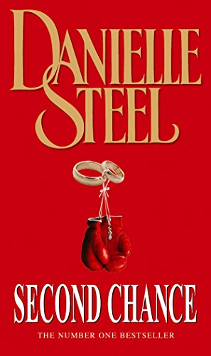 Red book cover with boxing glove, wedding ring, and gold lettering.