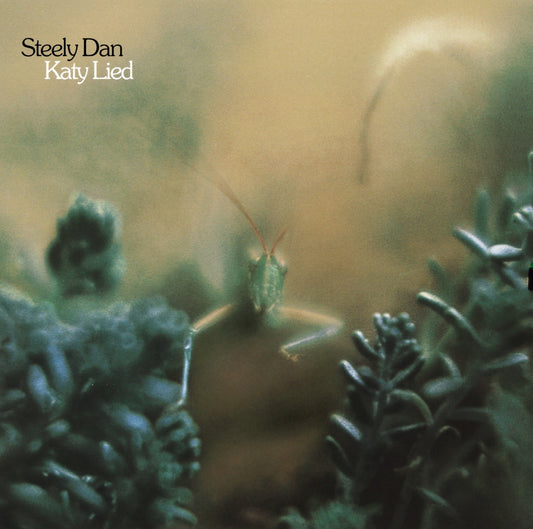Steely Dan's "Katy Lied" album cover featuring a green praying mantis.
