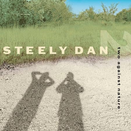 Steely Dan album cover: shadows of people pointing cameras in a field.