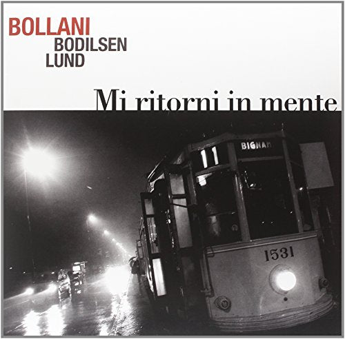Album cover: black and white photo of a tram at night.