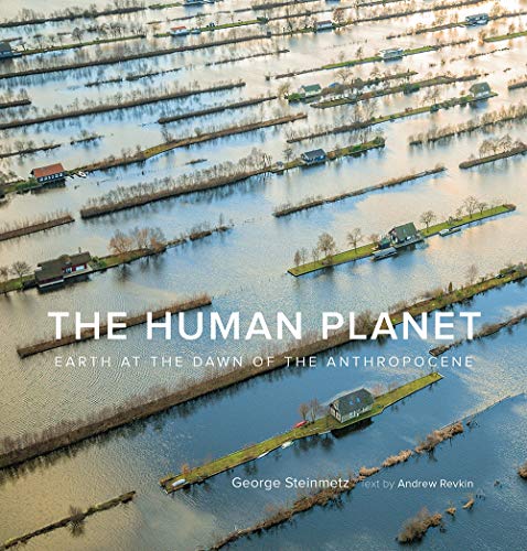 Book cover showing flooded landscape with houses, titled “The Human Planet.”