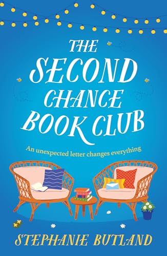 Book cover with title, chairs, a small table with books, and string lights.