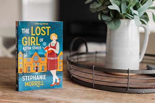 Book cover featuring a woman and illustrated building, with a white pitcher.