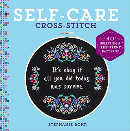 Book cover with cross-stitch hoop displaying text and colorful floral design.