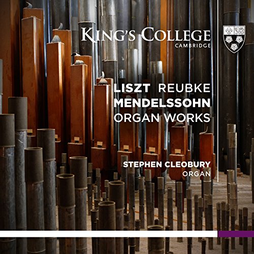 Close-up of many metal and wooden organ pipes with text overlay.