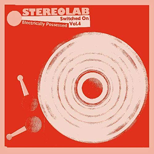 Stereolab album cover: red background with pink concentric circles and drumsticks.