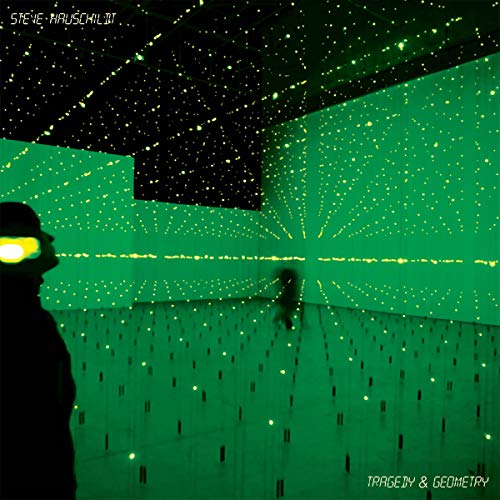 A person stands in a dark room filled with glowing green light grid patterns.