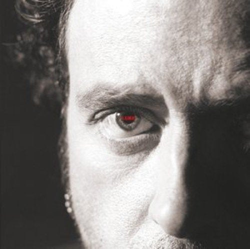 Black-and-white close-up of a man's face with red text in his eye.