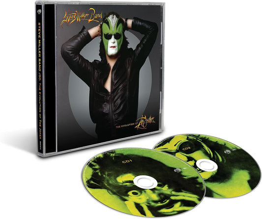 "CD case with man wearing green mask and two matching green CDs."
