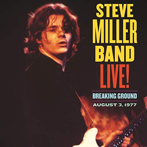 Steve Miller playing guitar on stage with album title text on the right side.