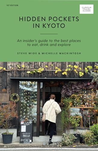 Green travel guide cover with a traditional Kyoto building and floral display.