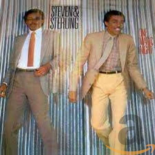CD cover featuring two men in suits against a textured silver background.
