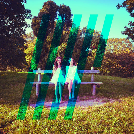 Two girls on a park bench with glitching, colorful vertical lines.